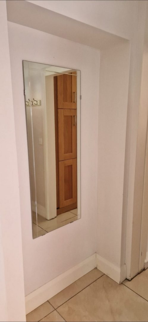 Clean empty hallway with a mirror, ready for the end of tenancy inspection