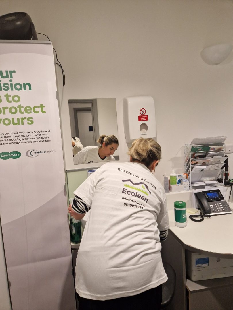 An Ecoleen cleaner in uniform at work, part of a cleaning company in Dublin