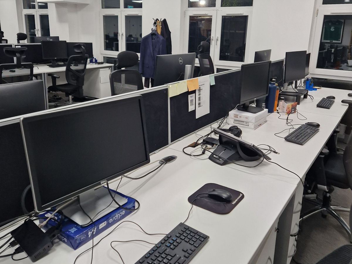 Rows of clean desks, screens and keyboards in a Dublin office after an evening clean